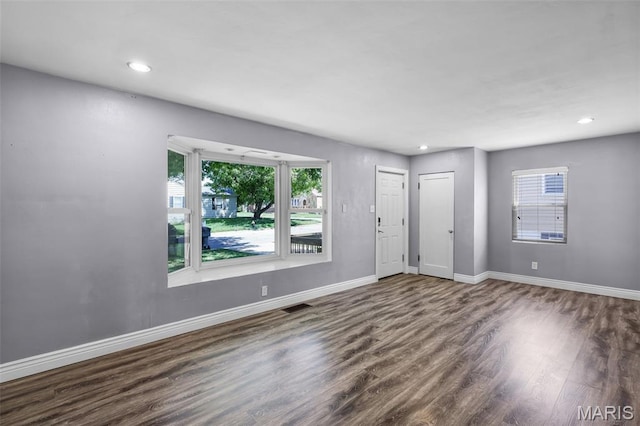 7104 Leona St, Saint Louis, MO 63116 - entryway with dark wood-style floors and recessed lighting