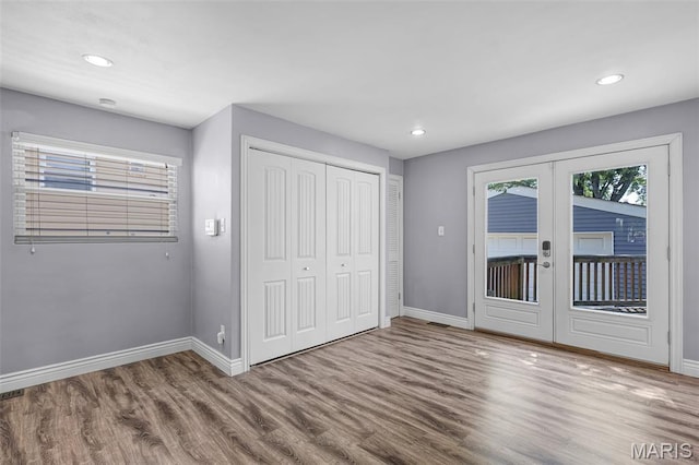 7104 Leona St, Saint Louis, MO 63116 - unfurnished bedroom featuring access to outside, wood finished floors, french doors, recessed lighting, and a closet