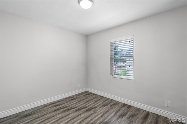 7104 Leona St, Saint Louis, MO 63116 - spare room with dark wood-style floors and baseboards