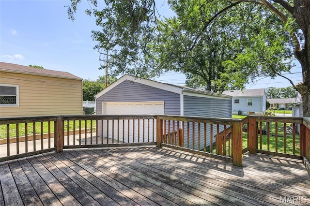 7104 Leona St, Saint Louis, MO 63116 - wooden deck featuring a detached garage and an outbuilding