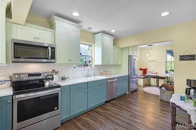 4846 S Point Rd, Washington, MO 63090 - kitchen featuring appliances with stainless steel finishes, pendant lighting, healthy amount of natural light, dark wood-style floors, and recessed lighting