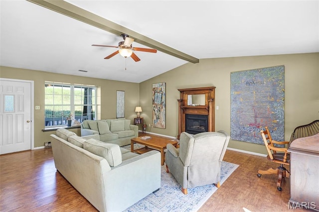 4846 S Point Rd, Washington, MO 63090 - living room featuring wood finished floors, ceiling fan, and a glass covered fireplace