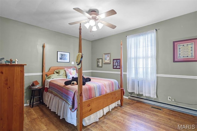 4846 S Point Rd, Washington, MO 63090 - bedroom featuring wood finished floors and a ceiling fan
