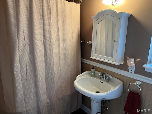 4846 S Point Rd, Washington, MO 63090 - bathroom featuring wainscoting and a sink