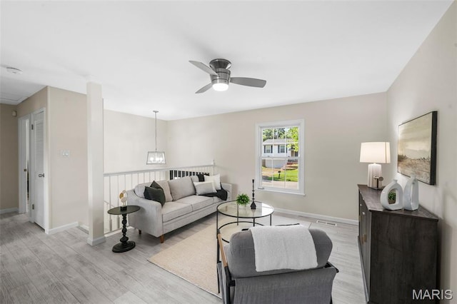 383 Messina Dr, Ballwin, MO 63021 - living area with light wood finished floors and a ceiling fan