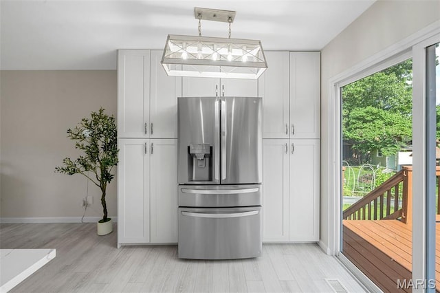 383 Messina Dr, Ballwin, MO 63021 - kitchen featuring stainless steel refrigerator with ice dispenser, white cabinetry, and light wood-style floors