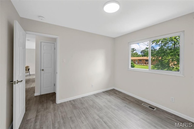 383 Messina Dr, Ballwin, MO 63021 - unfurnished room featuring light wood finished floors and a smoke detector