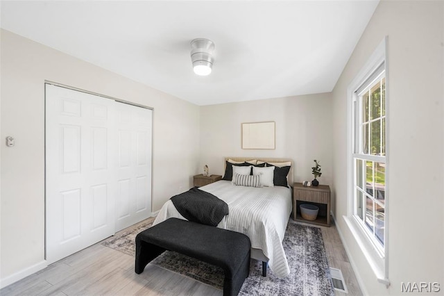 383 Messina Dr, Ballwin, MO 63021 - bedroom featuring light wood-style flooring and baseboards