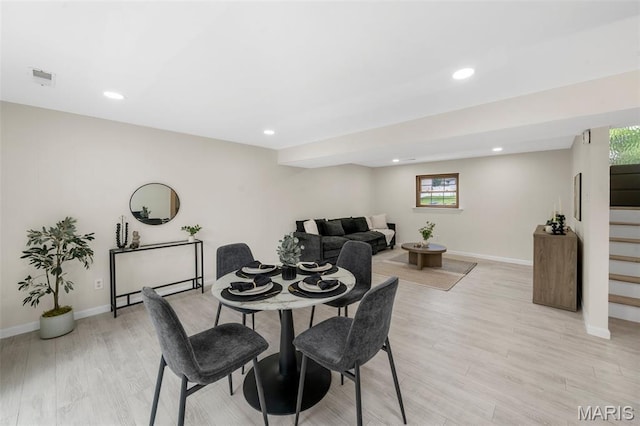 383 Messina Dr, Ballwin, MO 63021 - dining room featuring light wood-type flooring, recessed lighting, and stairs