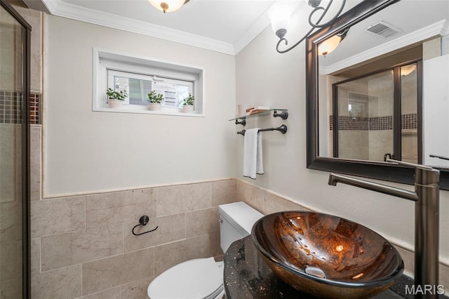 383 Messina Dr, Ballwin, MO 63021 - bathroom featuring tile walls, tiled shower, a wainscoted wall, and crown molding