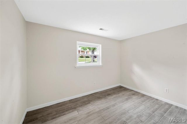 383 Messina Dr, Ballwin, MO 63021 - spare room with wood finished floors and baseboards
