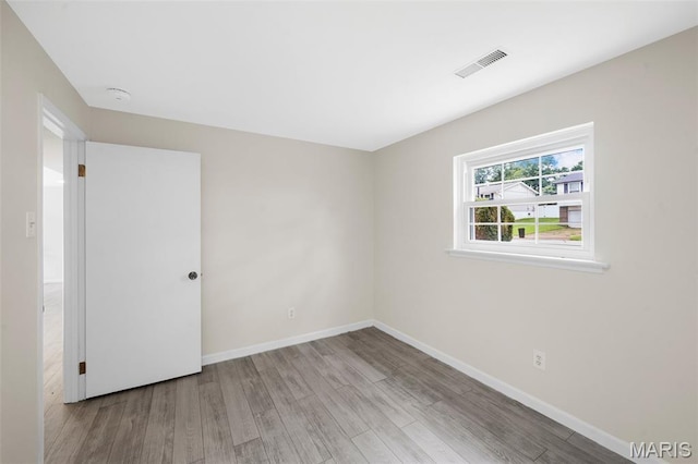 383 Messina Dr, Ballwin, MO 63021 - empty room with wood finished floors and a smoke detector