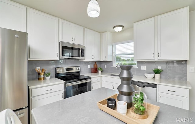 238 Charlestowne Place Dr, Saint Charles, MO 63301 - kitchen featuring appliances with stainless steel finishes, white cabinetry, and light countertops