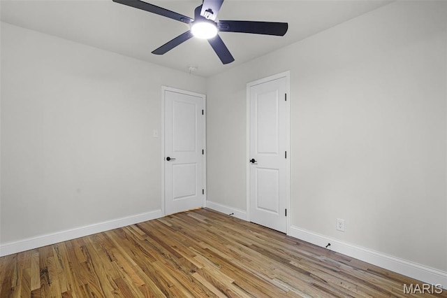 246 Leichester Cir, Ballwin, MO 63011 - spare room with light wood-type flooring and a ceiling fan