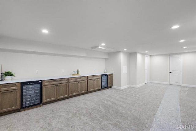 246 Leichester Cir, Ballwin, MO 63011 - indoor wet bar featuring wine cooler, recessed lighting, and light carpet