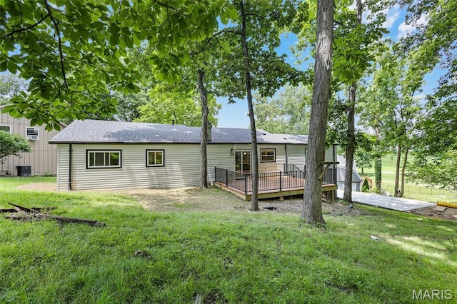 246 Leichester Cir, Ballwin, MO 63011 - back of property with a deck, a yard, and roof with shingles
