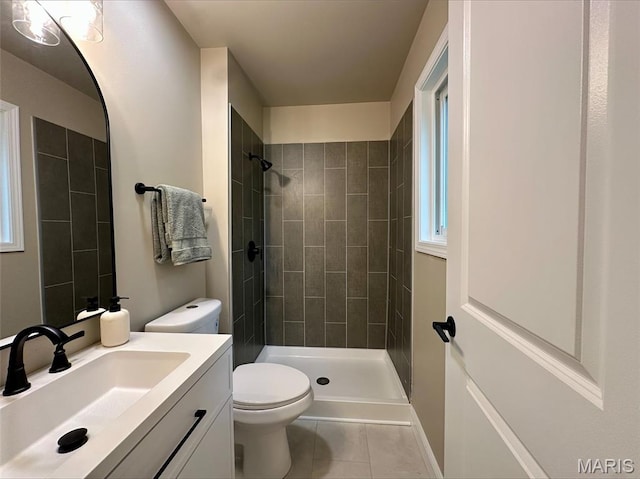 246 Leichester Cir, Ballwin, MO 63011 - bathroom featuring tile patterned floors, vanity, and tiled shower
