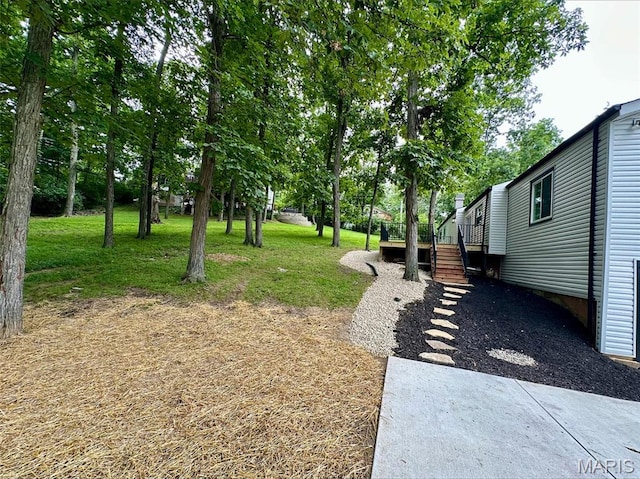 246 Leichester Cir, Ballwin, MO 63011 - view of yard with a wooden deck and stairs