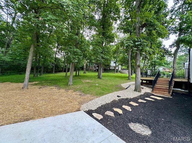 246 Leichester Cir, Ballwin, MO 63011 - surrounding community with stairway, a deck, and a lawn