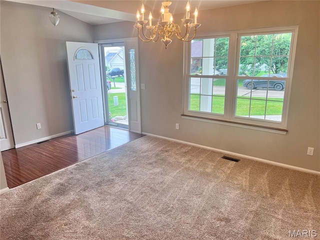 1 Calumet Meadows Ct, Ofallon, MO 63376 - carpeted foyer with a chandelier and baseboards