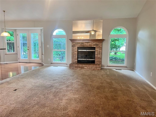 1 Calumet Meadows Ct, Ofallon, MO 63376 - unfurnished living room with ceiling fan, a brick fireplace, and carpet flooring