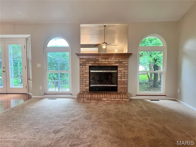 1 Calumet Meadows Ct, Ofallon, MO 63376 - unfurnished living room featuring carpet floors, a ceiling fan, and plenty of natural light