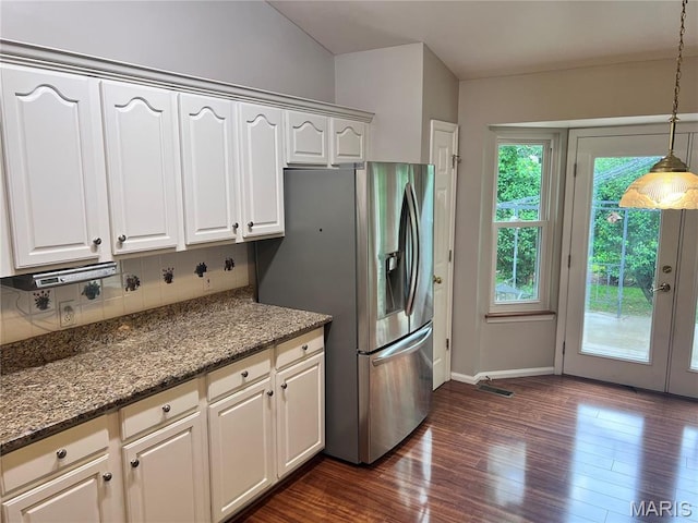 1 Calumet Meadows Ct, Ofallon, MO 63376 - kitchen with decorative backsplash, stainless steel fridge with ice dispenser, dark wood-type flooring, decorative light fixtures, and dark stone counters