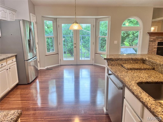 1 Calumet Meadows Ct, Ofallon, MO 63376 - kitchen featuring appliances with stainless steel finishes, dark wood-style flooring, white cabinets, and light stone countertops