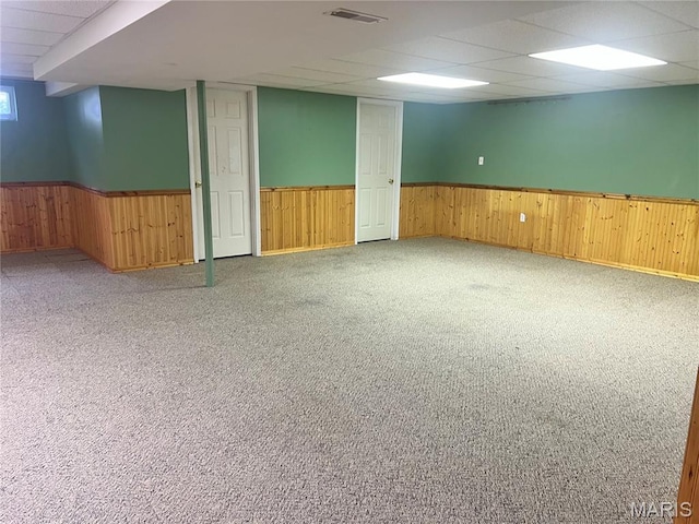 1 Calumet Meadows Ct, Ofallon, MO 63376 - basement with wainscoting, carpet floors, a paneled ceiling, and wood walls