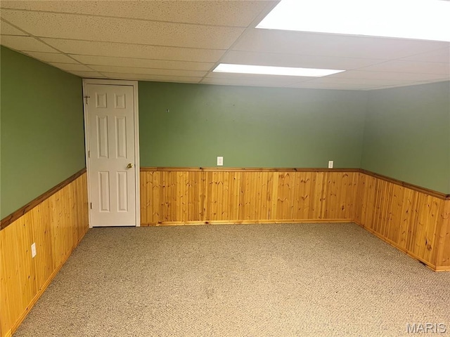 1 Calumet Meadows Ct, Ofallon, MO 63376 - carpeted spare room featuring a wainscoted wall, wooden walls, and a paneled ceiling