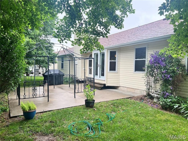 1 Calumet Meadows Ct, Ofallon, MO 63376 - back of property with a gazebo, a yard, a patio area, and roof with shingles