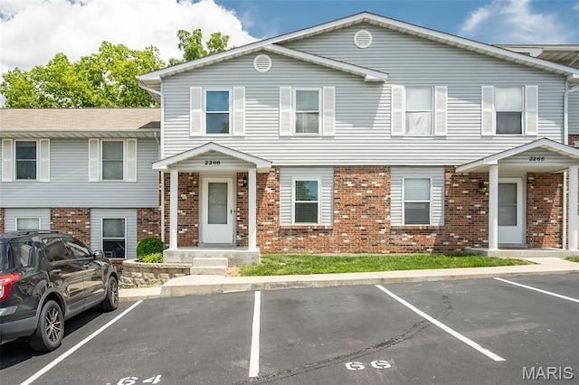 2266 Highland Hill Dr Unit F, Saint Peters, MO 63376 - townhome / multi-family property with uncovered parking and brick siding