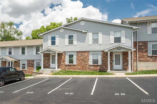 2266 Highland Hill Dr Unit F, Saint Peters, MO 63376 - townhome / multi-family property with uncovered parking and brick siding