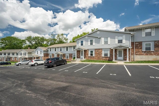 2266 Highland Hill Dr Unit F, Saint Peters, MO 63376 - uncovered parking lot featuring a residential view