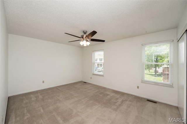 2266 Highland Hill Dr Unit F, Saint Peters, MO 63376 - unfurnished room with ceiling fan, light carpet, and a textured ceiling