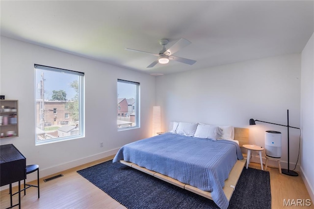 4133 Lafayette Ave, Saint Louis, MO 63110 - bedroom with light wood-style flooring and ceiling fan