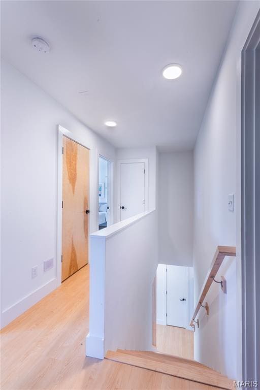 4133 Lafayette Ave, Saint Louis, MO 63110 - corridor featuring an upstairs landing, wood finished floors, and recessed lighting