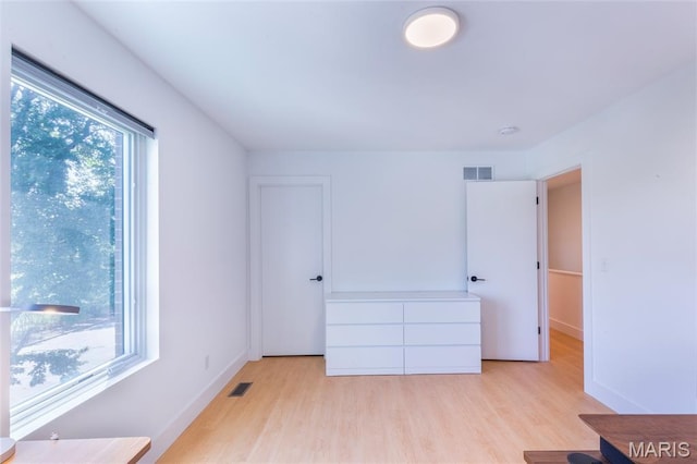 4133 Lafayette Ave, Saint Louis, MO 63110 - unfurnished bedroom featuring light wood-style floors