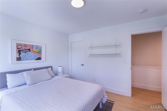4133 Lafayette Ave, Saint Louis, MO 63110 - bedroom featuring light wood-style flooring and a closet