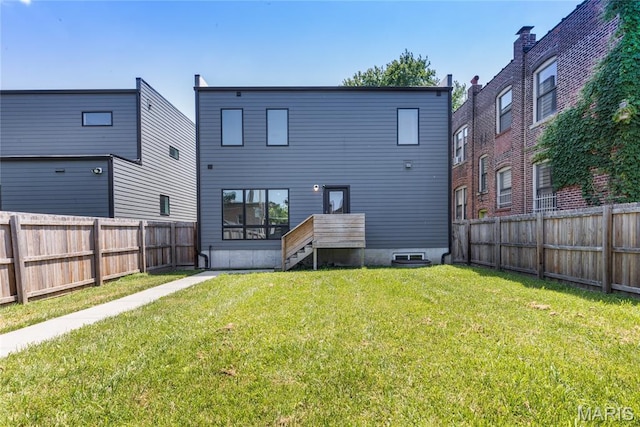 4133 Lafayette Ave, Saint Louis, MO 63110 - rear view of house featuring a fenced backyard