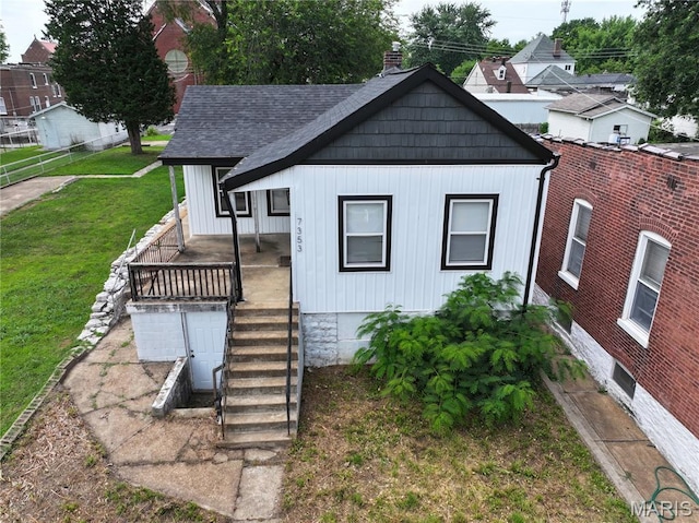 7353 Virginia Ave, Saint Louis, MO 63111 - view of front facade featuring a chimney and a porch