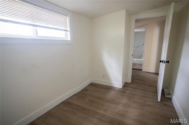 7353 Virginia Ave, Saint Louis, MO 63111 - empty room with wood finished floors and a smoke detector