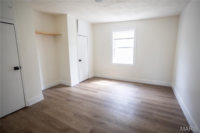 7353 Virginia Ave, Saint Louis, MO 63111 - unfurnished bedroom featuring wood finished floors and a closet