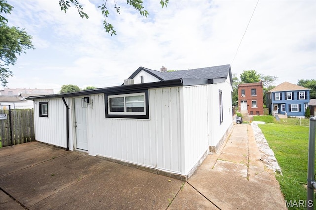 7353 Virginia Ave, Saint Louis, MO 63111 - view of front of house featuring board and batten siding and a patio