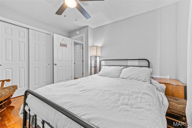 bedroom featuring wood finished floors, a closet, and ceiling fan