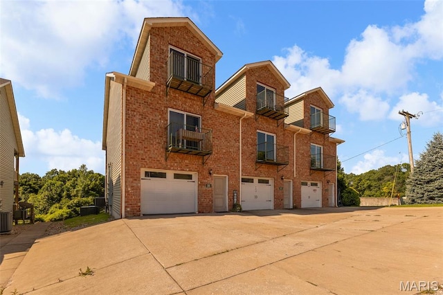 319 Timber Ridge Dr, Grafton, IL 62037 - view of front of home featuring an attached garage, driveway, and brick siding