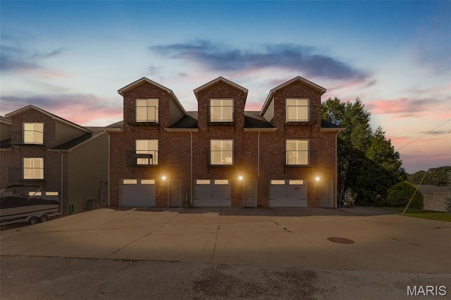 319 Timber Ridge Dr, Grafton, IL 62037 - multi unit property with a garage, driveway, and brick siding