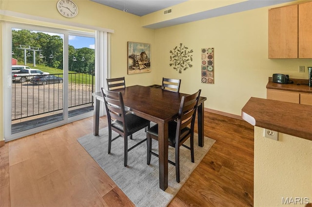 319 Timber Ridge Dr, Grafton, IL 62037 - dining room with wood finished floors