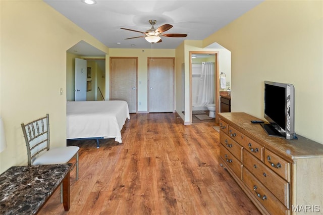 319 Timber Ridge Dr, Grafton, IL 62037 - bedroom featuring wood finished floors, multiple closets, and connected bathroom