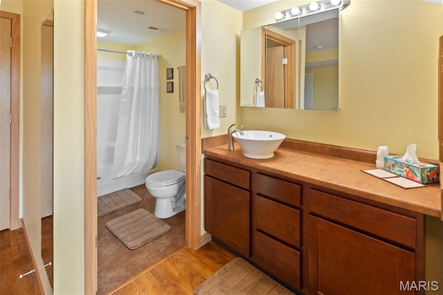 319 Timber Ridge Dr, Grafton, IL 62037 - bathroom featuring vanity, wood finished floors, and shower / bath combination with curtain